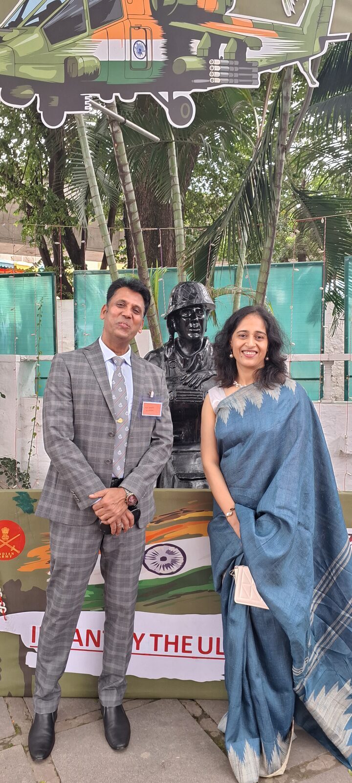 Capt. Prabhu at a corporate event, networking beside an Indian Army display.